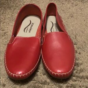 Red hand made leather shoes.